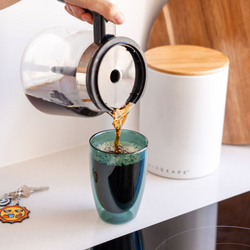 Coffee poured into coloured cup