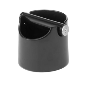 A black mini waste bin, also known as a knock box, for coffee beans with a silicone base and aluminum body.
