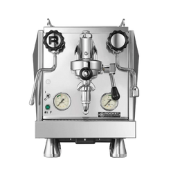 A silver Rocket Espresso Giotto Cronometro V espresso machine with pressure gauges, steam wand, and a portafilter.
